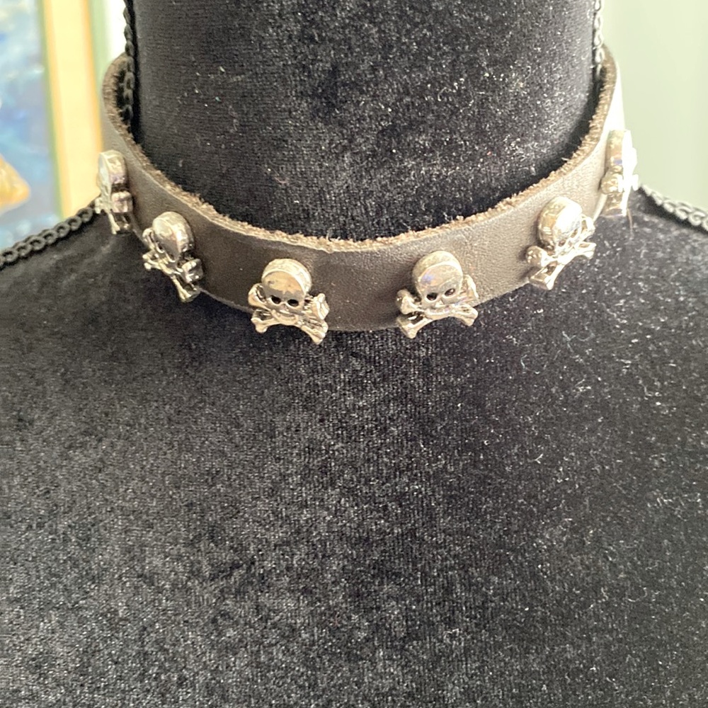 Black leather choker with stainless steel skull ☠️ crossbones detail.